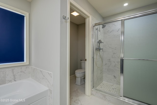 bathroom featuring toilet, marble finish floor, a stall shower, and a bath