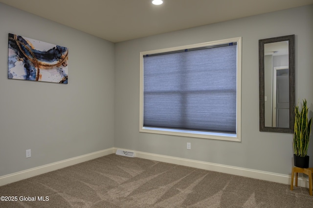 carpeted empty room featuring recessed lighting, visible vents, and baseboards