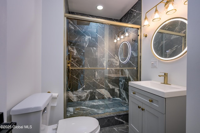 bathroom featuring a marble finish shower, marble finish floor, toilet, and vanity