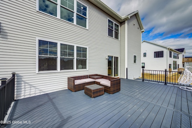 wooden terrace featuring outdoor lounge area