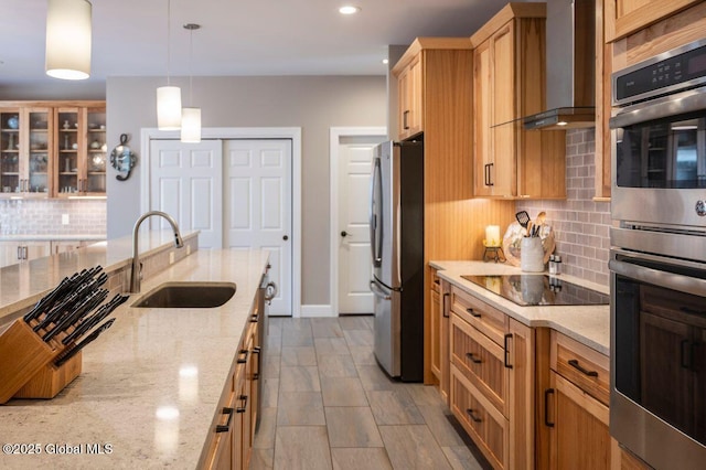 60 Federal Hill Rd, Bolton, NY 12814 - kitchen featuring appliances with stainless steel finishes, wall chimney range hood, backsplash, light stone counters, and hanging light fixtures