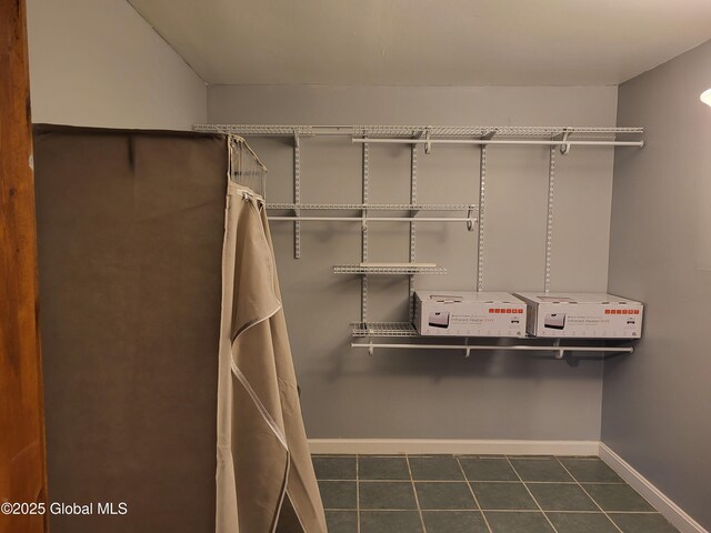 36-38 Main St, Petersburgh, NY 12138 - walk in closet featuring dark tile patterned floors