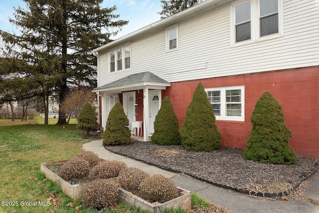 traditional-style home with a front lawn