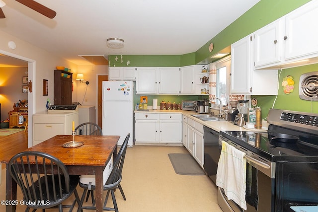 kitchen with washing machine and dryer, dishwasher, stainless steel range with electric cooktop, freestanding refrigerator, and a sink