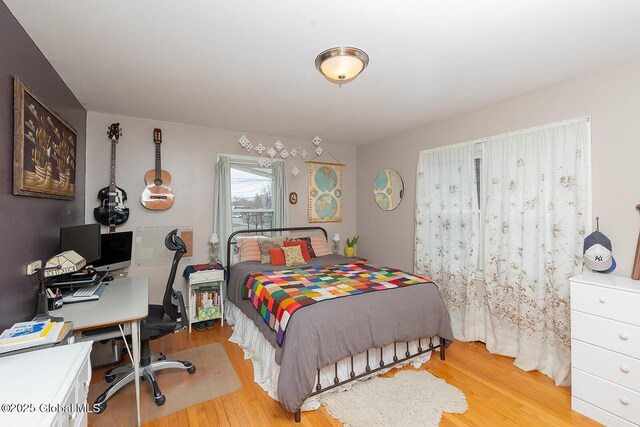 bedroom with light wood finished floors