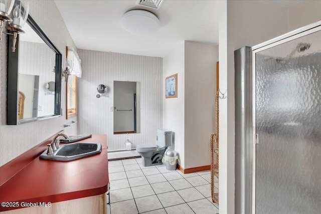 full bathroom featuring wallpapered walls, a shower stall, a baseboard heating unit, tile patterned floors, and toilet