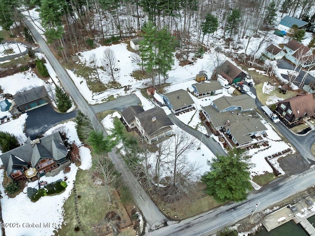 snowy aerial view featuring a residential view