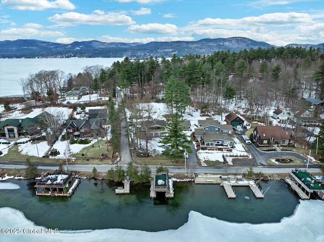 bird's eye view with a residential view and a water and mountain view