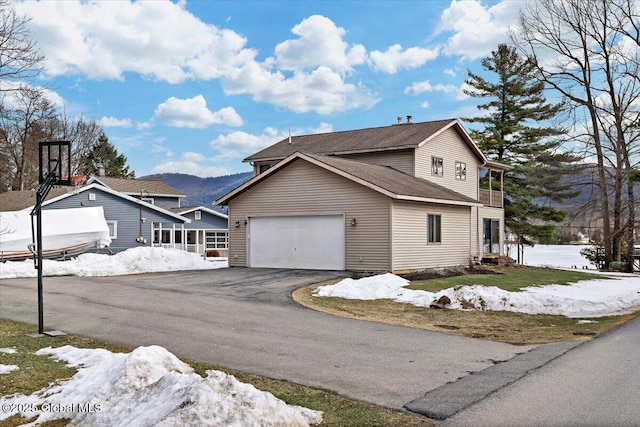 view of front of property with a garage and driveway