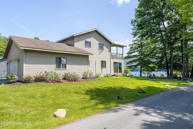 133 Assembly Point Rd, Queensbury, NY 12845 - view of front of home featuring a front yard, a balcony, and an attached garage