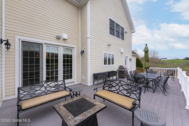 1014 Catherines Woods Dr, Niskayuna, NY 12309 - wooden deck featuring outdoor dining area, grilling area, and a fire pit