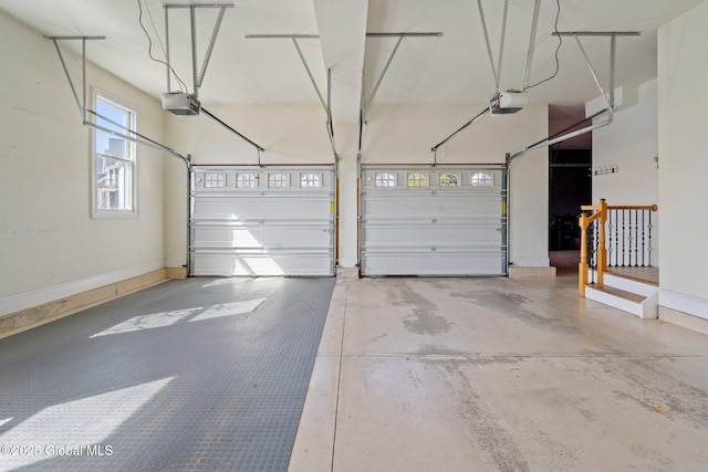 1014 Catherines Woods Dr, Niskayuna, NY 12309 - garage featuring a garage door opener and baseboards