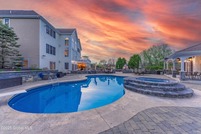 1014 Catherines Woods Dr, Niskayuna, NY 12309 - pool at dusk with a patio, an in-ground hot tub, an outdoor pool, and a gazebo