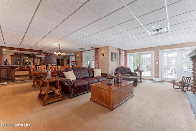 1014 Catherines Woods Dr, Niskayuna, NY 12309 - living area with a drop ceiling, light colored carpet, and a chandelier