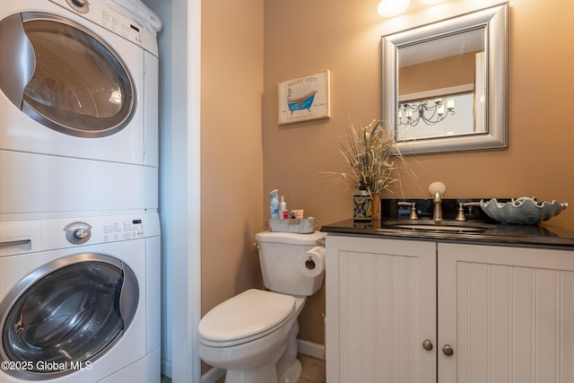 1014 Catherines Woods Dr, Niskayuna, NY 12309 - bathroom with stacked washer / dryer, toilet, and vanity
