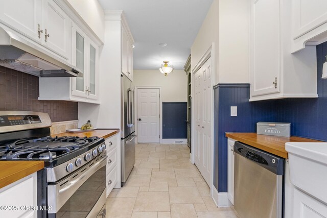 1014 Catherines Woods Dr, Niskayuna, NY 12309 - kitchen featuring stainless steel appliances, butcher block countertops, under cabinet range hood, and backsplash