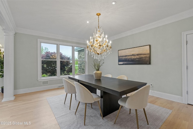 1014 Catherines Woods Dr, Niskayuna, NY 12309 - dining space featuring ornate columns, baseboards, crown molding, light wood finished floors, and a chandelier