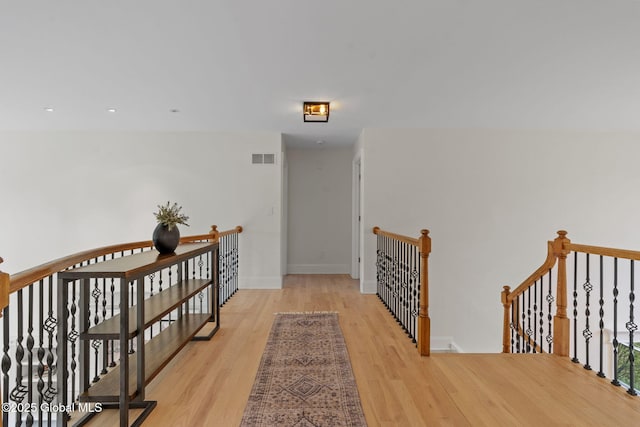 1014 Catherines Woods Dr, Niskayuna, NY 12309 - hall featuring an upstairs landing, light wood-type flooring, and baseboards