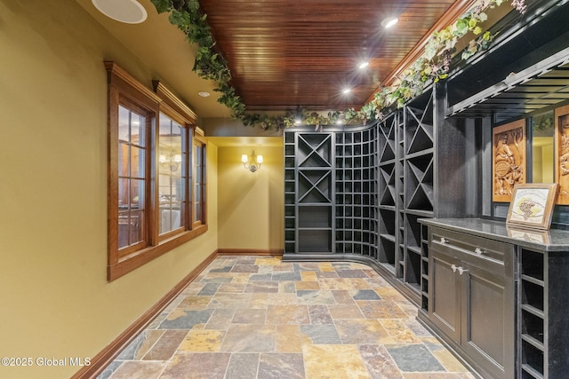 1014 Catherines Woods Dr, Niskayuna, NY 12309 - wine room with baseboards, stone tile flooring, and wood ceiling