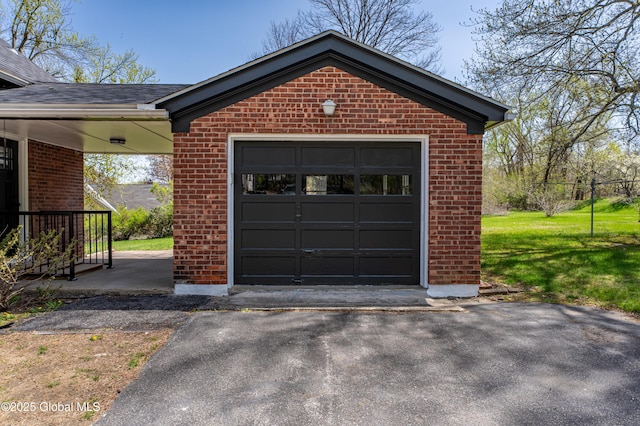 garage with aphalt driveway