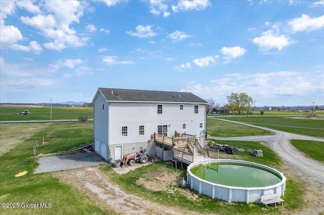 346 State Route 197, Fort Edward, NY 12828 - back of property featuring a deck, a yard, and dirt driveway