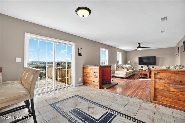 346 State Route 197, Fort Edward, NY 12828 - living room featuring visible vents, a ceiling fan, and baseboards