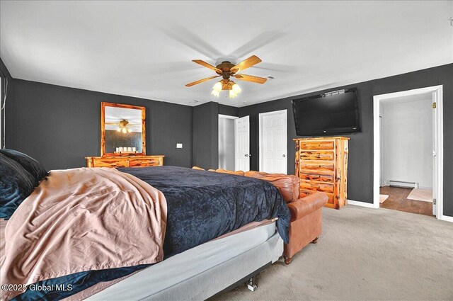 346 State Route 197, Fort Edward, NY 12828 - carpeted bedroom with a baseboard heating unit, ceiling fan, and baseboards