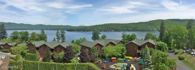 view of water feature with a forest view