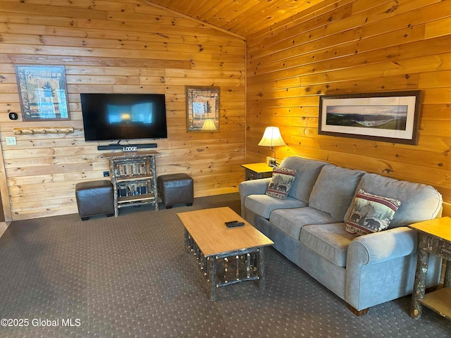 carpeted living area featuring wooden walls, vaulted ceiling, and wood ceiling