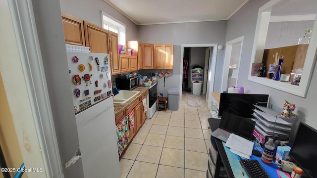 9 Penrose Ave, Mechanicville, NY 12118 - kitchen with light tile patterned flooring, stainless steel microwave, freestanding refrigerator, and ornamental molding