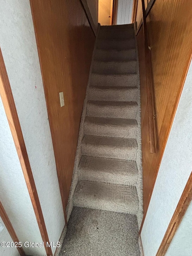 stairway with a textured wall