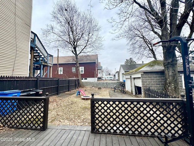 deck with an outdoor structure and fence
