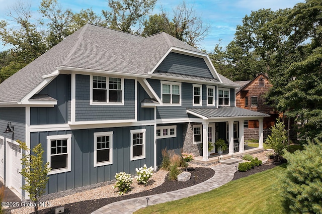 view of front of home featuring metal roof, a porch, a standing seam roof, and board and batten siding