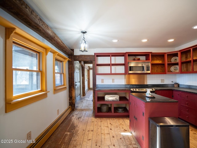 kitchen with open shelves, light wood-style flooring, appliances with stainless steel finishes, dark countertops, and a baseboard heating unit