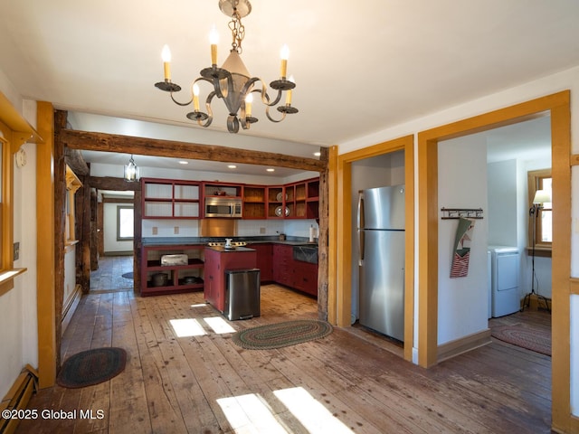 kitchen with a chandelier, stainless steel appliances, open shelves, wood-type flooring, and a center island