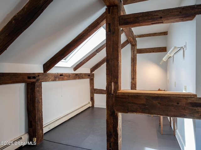 bonus room with lofted ceiling with skylight, concrete floors, and a baseboard radiator