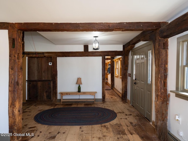 entryway featuring hardwood / wood-style flooring, beamed ceiling, and a baseboard radiator