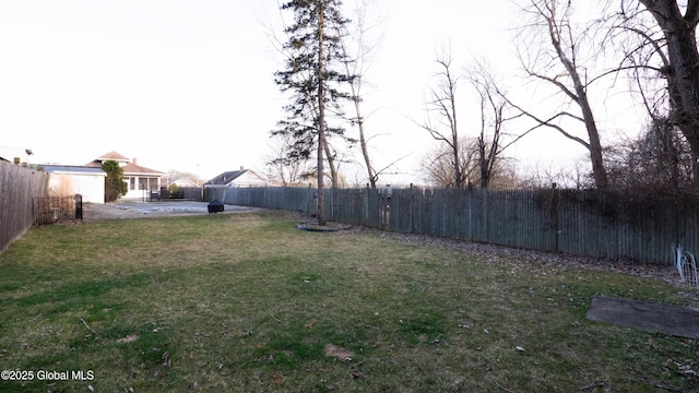 view of yard with a patio and a fenced backyard