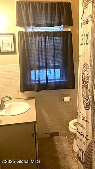 2373 Burdett Ave, Troy, NY 12180 - full bathroom featuring vanity, tile walls, toilet, and tile patterned floors