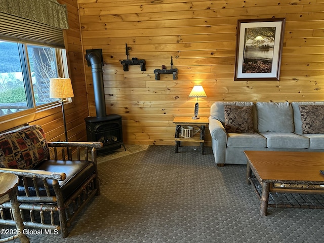 3210 Lake Shore Dr # 34Interval 5, Lake George, NY 12845 - sitting room featuring wooden walls, carpet floors, and a wood stove
