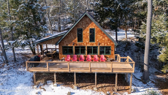 back of house with a deck