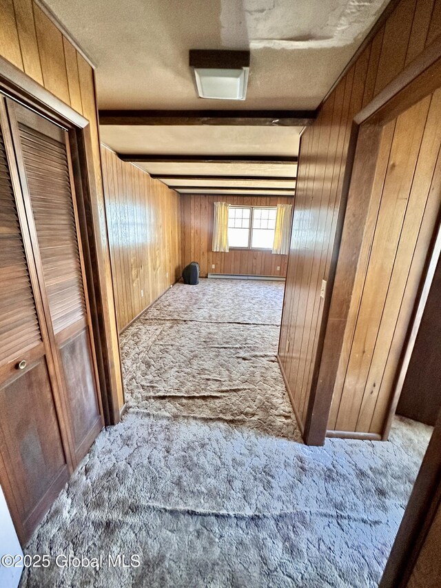 11 Middlesex Rd, East Greenbush, NY 12061 - hall with beam ceiling, wood walls, a textured ceiling, and carpet floors