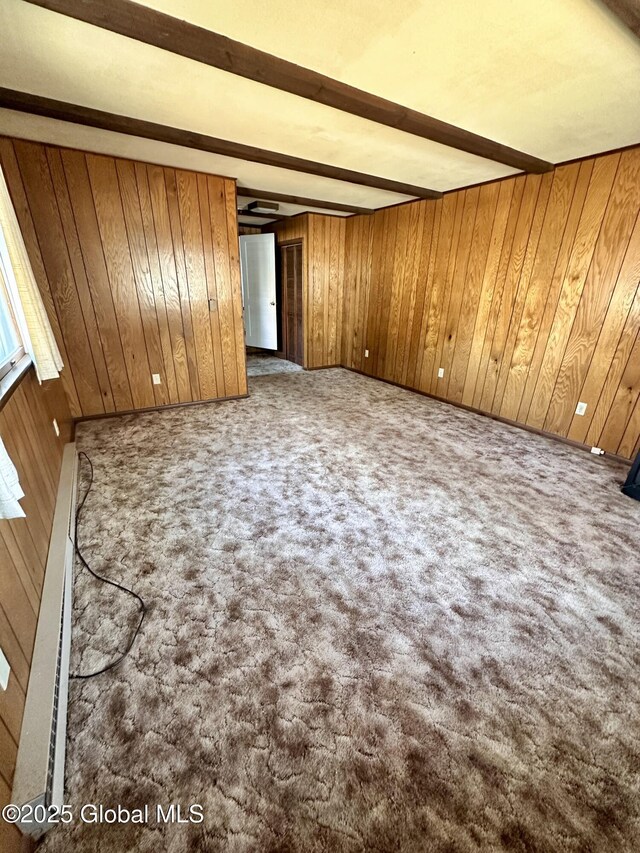 11 Middlesex Rd, East Greenbush, NY 12061 - unfurnished room with beamed ceiling, carpet, baseboard heating, and wood walls