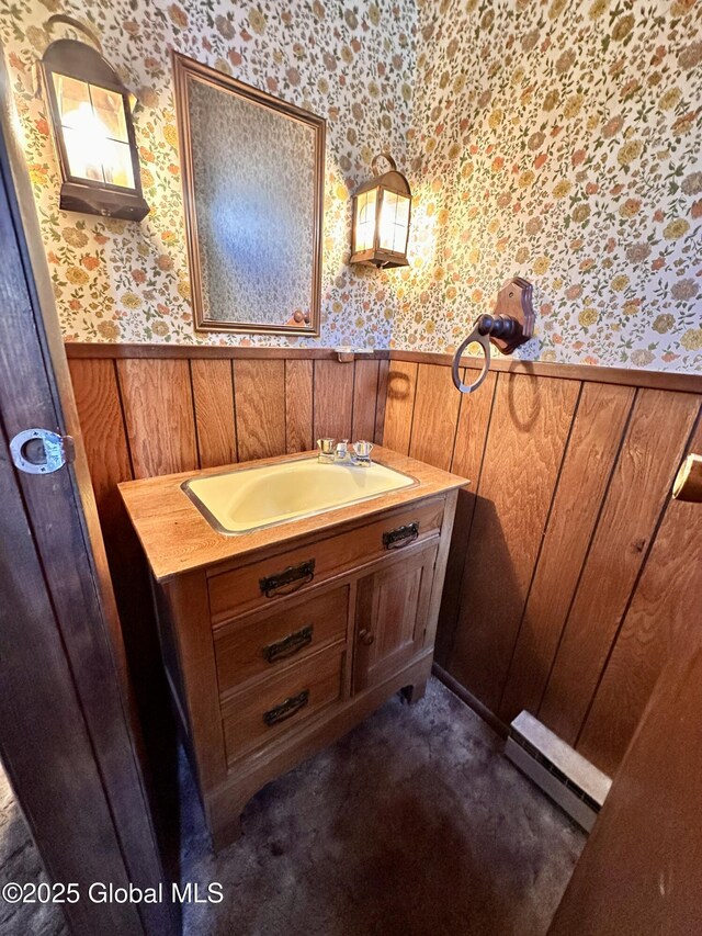 11 Middlesex Rd, East Greenbush, NY 12061 - bathroom with vanity, baseboard heating, wainscoting, and wallpapered walls