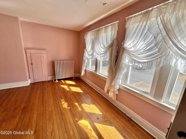 11 Middlesex Rd, East Greenbush, NY 12061 - bonus room with radiator, baseboards, and wood-type flooring