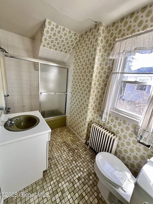11 Middlesex Rd, East Greenbush, NY 12061 - full bathroom with wallpapered walls, toilet, and radiator heating unit