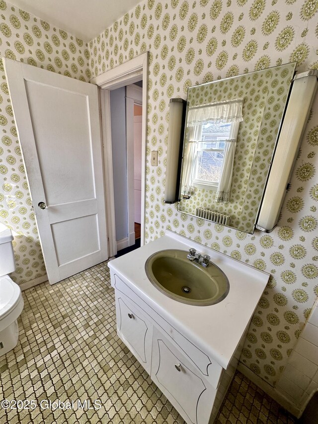 11 Middlesex Rd, East Greenbush, NY 12061 - bathroom featuring tile patterned flooring, toilet, wallpapered walls, and vanity