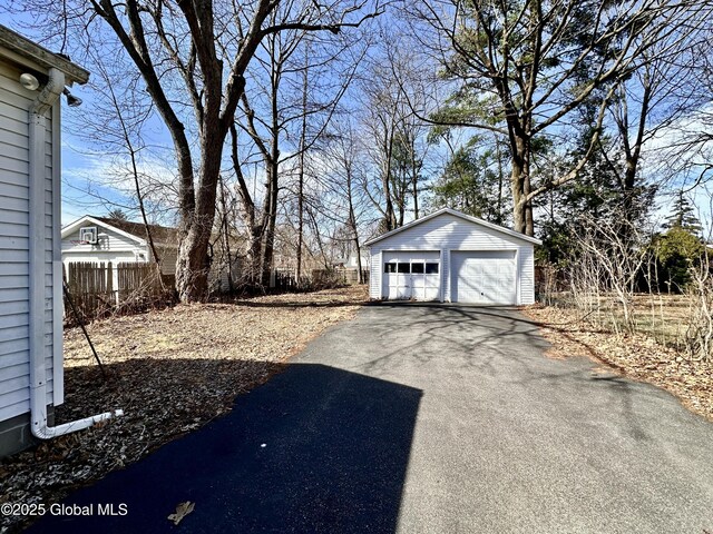 11 Middlesex Rd, East Greenbush, NY 12061 - exterior space featuring a detached garage, an outbuilding, and fence