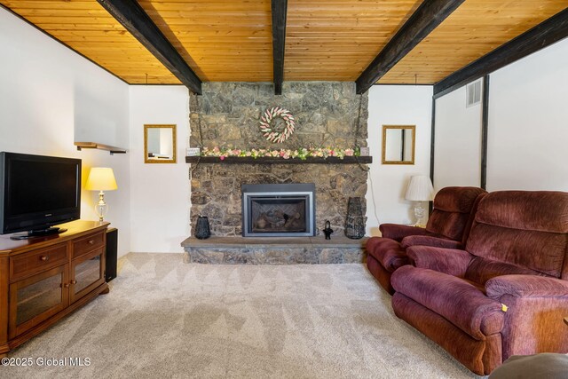carpeted living room featuring wooden ceiling, beam ceiling, and a fireplace