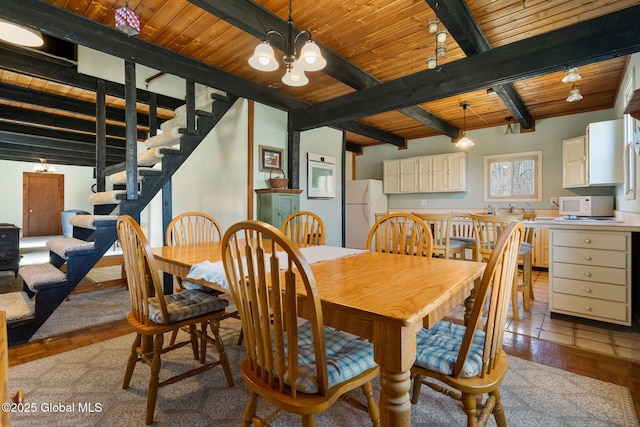 dining room featuring wood ceiling, stairway, beamed ceiling, and a chandelier